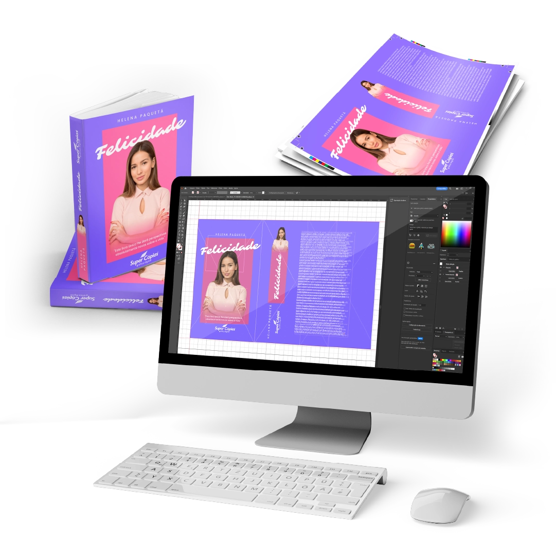 Computador e livros exibindo processo de diagramação de um livro.